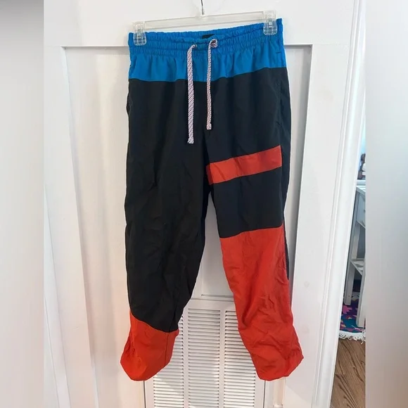 NIKE FLIGHT TRACK PANTS "BLK/ORANGE" - Picture 2 of 6